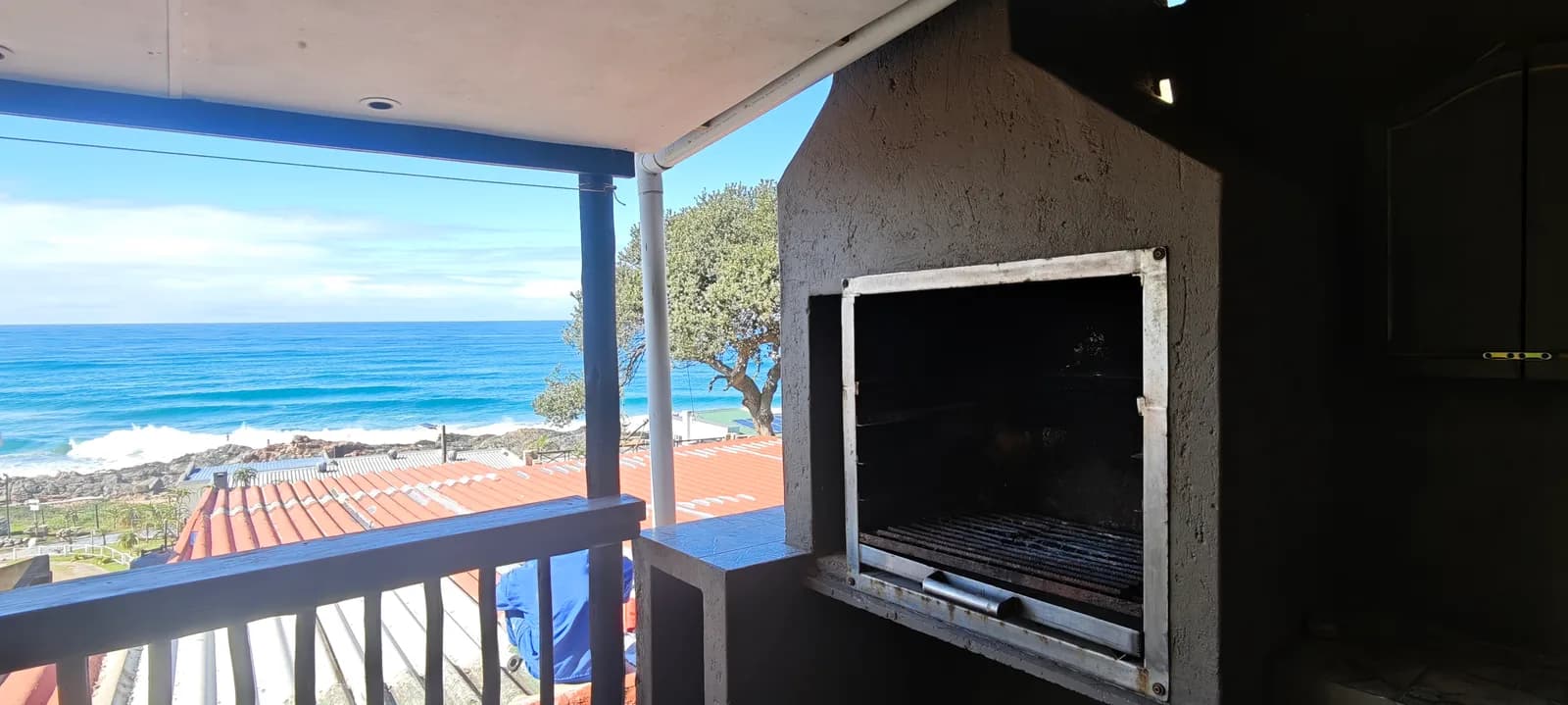 Built-in braai on the stoep, looking out over the water