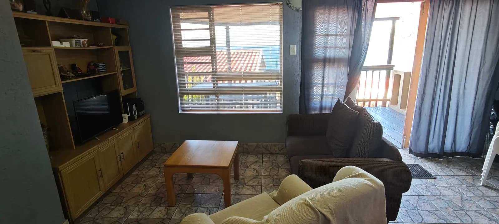 Living room with sofas and a sea view through the window