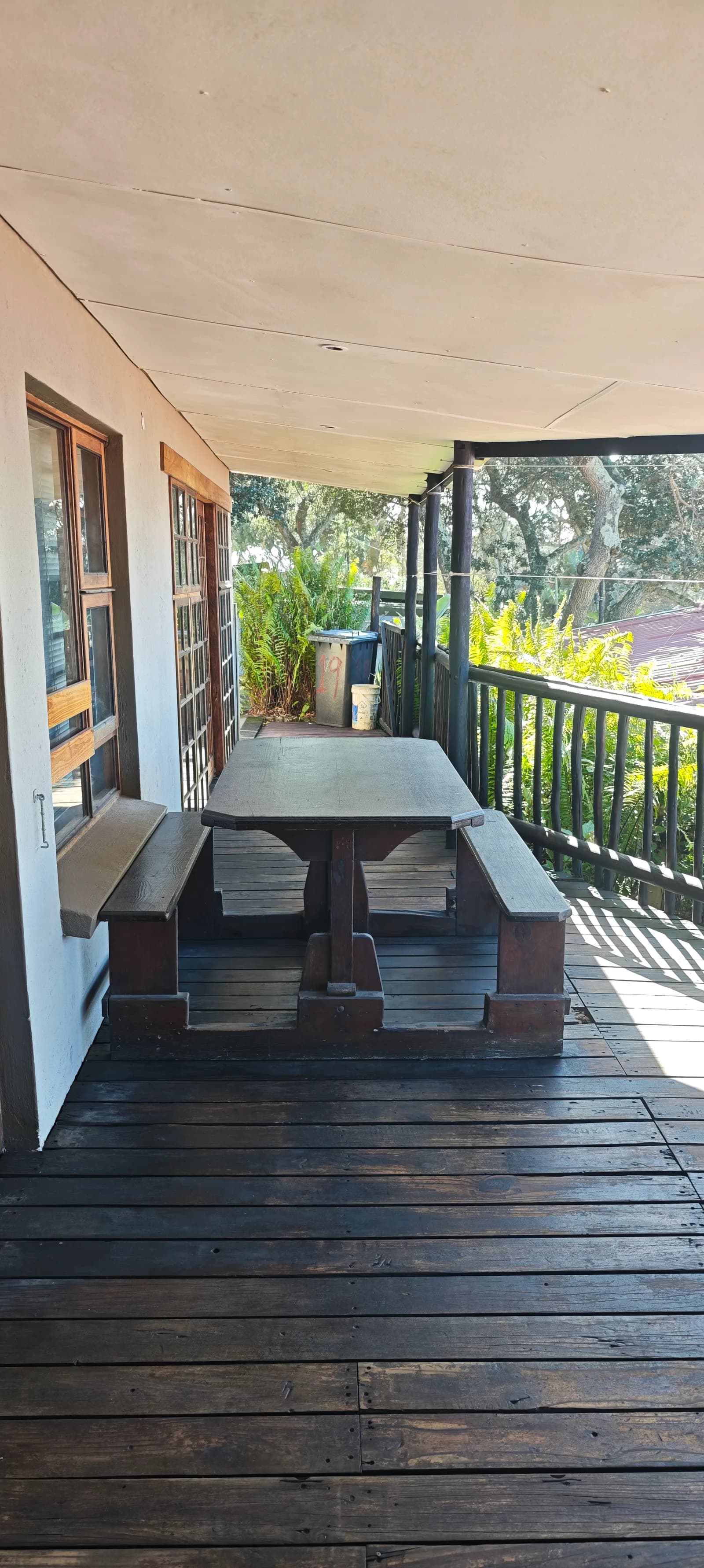 Table and benches on the deck, in the shade